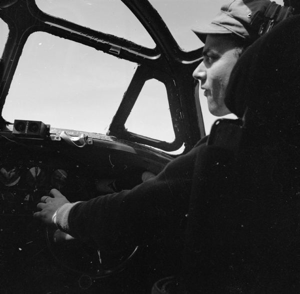Robert Doyle in a Consolidated B-24 Liberator warplane during the Alexishafen strike. Alexishafen was a Japanese occupied airbase located on the northeast coast of New Guinea (present day Papua New Guinea), near Madang.