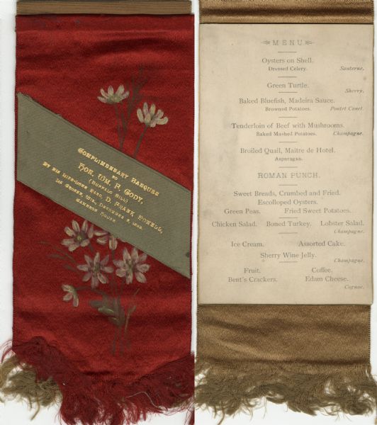 Fringed red silk overlay cover and gold silk ribbon backed menu page, sewn at top, for a "Complimentary Banquet to Hon. Wm. F. Cody, (Buffalo Bill) by his life-long pard, D. Frank Powell," at Cameron House, with an olive silk banner affixed diagonally across the front, and hand-painted flowers beneath.