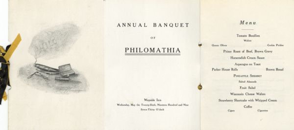 Front cover and first two pages of the Philomathia literary society  annual banquet program at the University of Wisconsin-Madison, with a cover illustration by William J. Meuer of a lighted cigar with a cloud of smoke containing the letters "PHILO," a box of Trophies cigars, and matches. The program is bound with doubled gold and black satin ribbons.