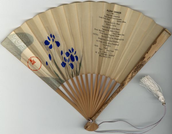Menu for an Aloha Dinner on the Japanese passenger ship, M.S. <i>Chichibu Maru</i>, printed on a folding paper and bamboo hand fan, with painted blue irises and an artist's seal (?). A tasseled silk cord is attached to the base of the fan.