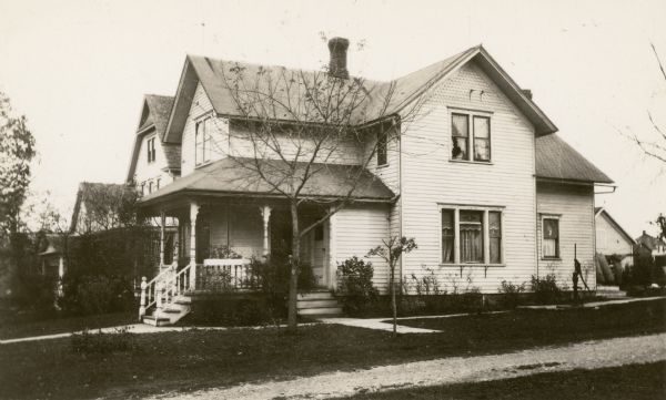 Submitted as an example of "The Homes of Pupils," this two-story Victorian house was the parsonage of Peace Reformed Church and home of Pastor Edward P. Nuss. His son Willard attended Potter School. There is a hand-pump on the side of the house.