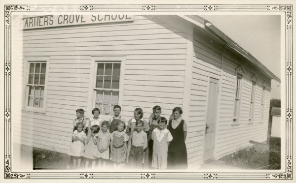 Students pose in front of Farmer's Grove School, District No #3, Towns of York and New Glarus.