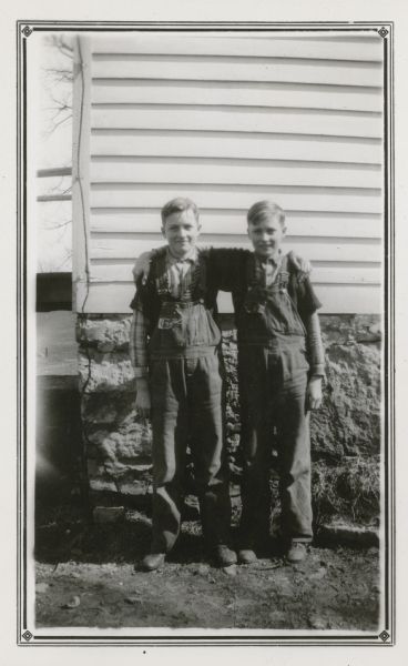 Twin brothers Glen and Gilman Blomquist pose in the school yard at the Mud Branch School. The boys are 12-years-old and in the sixth grade.