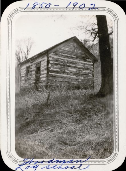The Woodman log school, in the township of Westford, was in use from 1850 until 1902, when a new school was built "just a few rods away." It is noted on the reverse of the photograph that this was "the only log school house left in Richland County in 1932." The building shows signs of neglect.