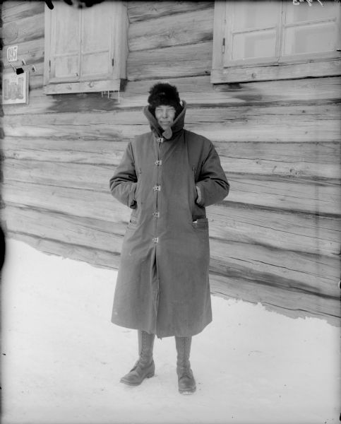 A portrait of Captain McArdle from Company A of the 310th United States Army Engineer Corps, wearing heavy winter clothing outside the Headquarters of the 310th Army Engineer Corps.
