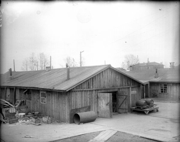 Slightly elevated exterior view of the 310th United States Army Engineer Corps, Company C's blacksmith shop.