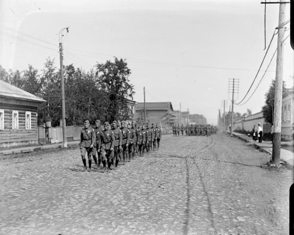 An army unit from the 310th United States Army Engineer Corps marching through town. The group is being lead by Captain McArdle from Company A, 310th United States Army Engineer Corps.