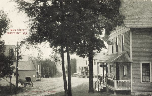 View of Main Street, Sister Bay, looking downhill. Caption reads: Main Street, Sister Bay, Wis."