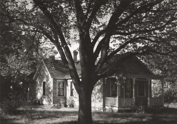 View across yard of a house beside the Portage Canal. It was unoccupied at the time of this photograph.