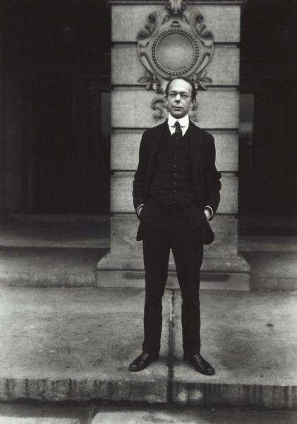 Carl Russell Fish, noted professor of American history at the University of Wisconsin, shown standing on the steps of the State Historical Society building.