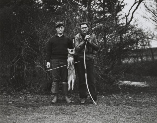 Mr. Shorer and companion with a fox shot with bow and arrow.