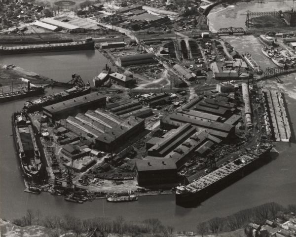 Aerial view showing shipyards, rivers and roads.