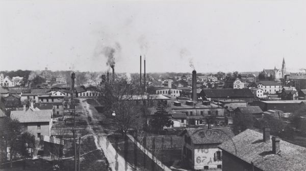 Elevated view of town with homes and factories.