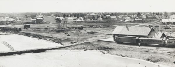 Section of overall panorama, showing railroad station.