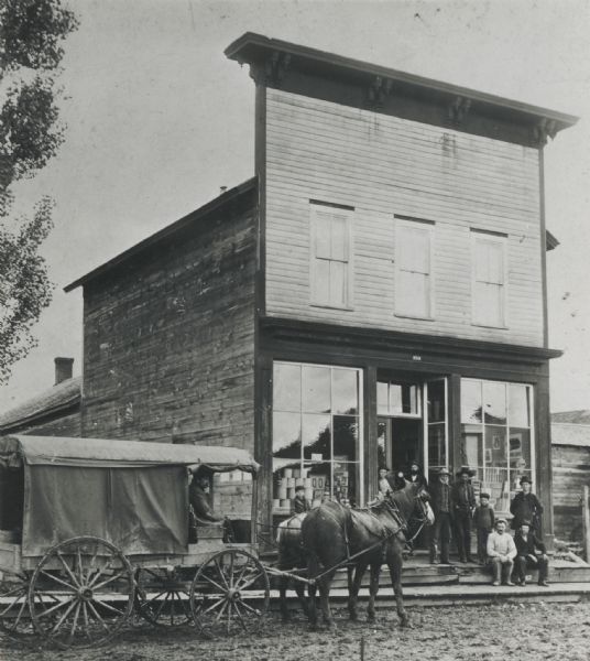 Caption: "Stage driven by William C. Alden stopping in front of Coon Valley store on the route between Viroqua to Muscoda and La Crosse. Alden drove the stage for 25 years."