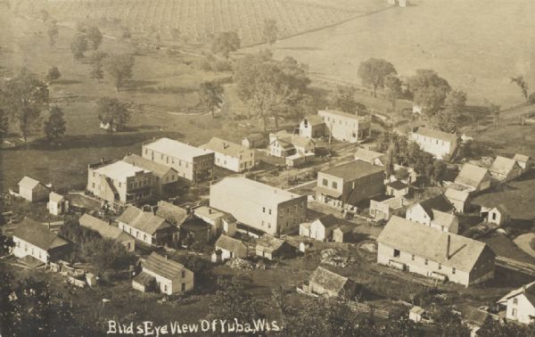 Elevated view of town. Caption reads: "Bird's-Eye View of Yuba, Wis."