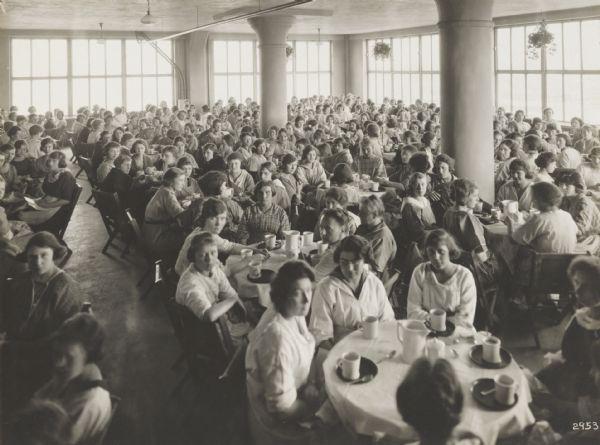 Factory girls' “club” gathered for coffee in plant refreshment room in the Milwaukee Paper Box Co.