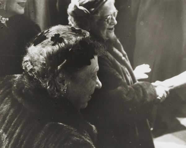 Two elderly women at a reception at the Pabst Theater.
