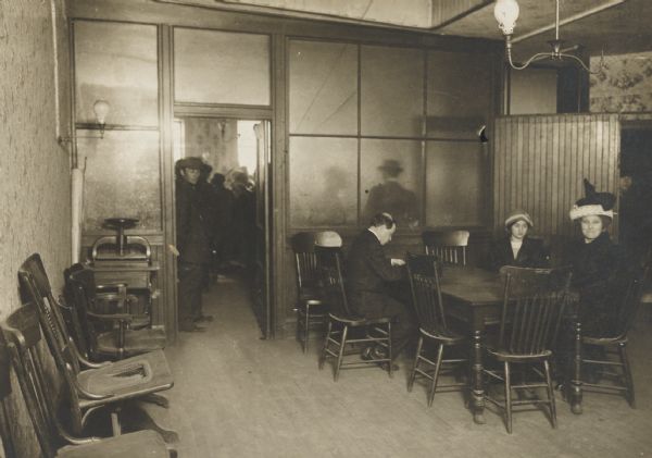 Interior of the Milwaukee office of the Wisconsin State Employment Service, with applicants for work.
