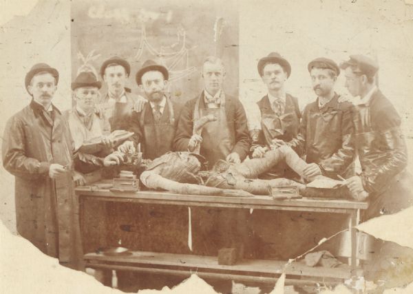 Group of medical students (?) and instructor (?) posed around a cadaver. Presented by Dr. John G. Meachem III of Racine, Wis. Probably a dissection class at Rush Medical College in Chicago, Ill., from which Dr. Meachem was graduated in 1897.