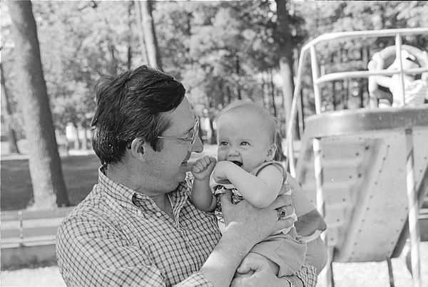 Kissing babies, a hallmark of political campaigning. The candidate here is Congressman David R. Obey. The baby is unidentified.