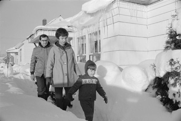 The Obey family walking in the snow at their house located at 515 N. 9th Avenue in Wausau; a casual portrait taken for David Obey's first campaign for Congress.