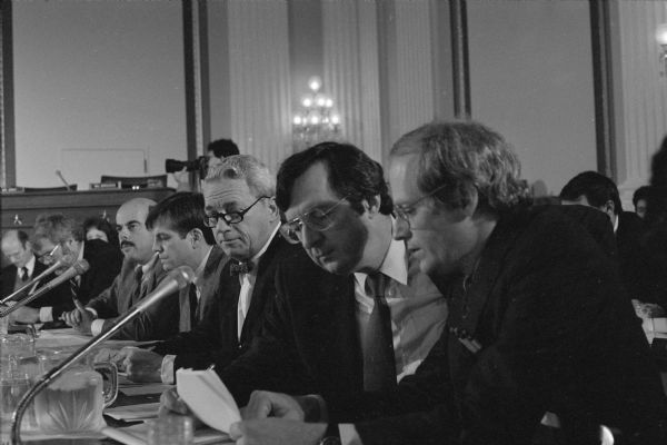 Wisconsin Congressman David R. Obey (second from the right) confers with Scott Lilly, a top policy advisor, during a hearing of the House Budget Committee.