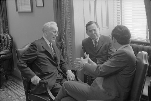 Wisconsin Congressman David R. Obey (facing away from the camera) with Democratic leaders John McCormack and Carl Albert. The photograph was taken for a brochure for Obey's first reelection campaign.