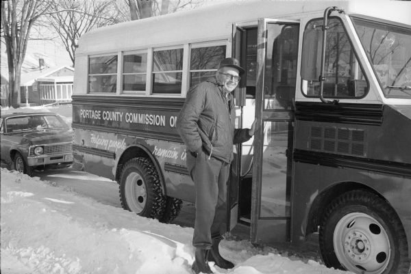 Bus operated by the Portage County Commission on Aging and its driver. The bus took senior citizens to lunch at the Senior Center and provided other services that allowed people to remain independent in their own homes.