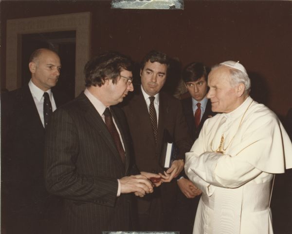 Wisconsin Congressman David R. Obey (in profile) meeting with Pope John Paul II. Obey was heading a congressional delegation that had visited Poland. Obey reported to the Pope on the conversation they had had with various Communist members of the Polish parliament. The news about his country, Obey said later, made the Pope very angry.