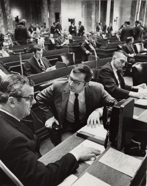 Democratic leadership on the Wisconsin Assembly floor: left to right: Robert T. Huber, minority leader; David R. Obey, assistant minority leader, and Norman C. Anderson. Anderson eventually followed Huber to the leadership post. Obey went on to serve 41 years in the U.S. Congress.