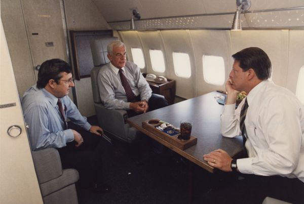 Wisconsin Congressman David R. Obey, Speaker of the House Tom Foley, and Vice President Al Gore on board Air Force Two.