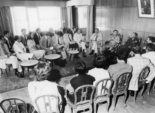 Egyptian President Anwar Sadat and Vice President Hosni Mubarak seated at the far right with a delegation of congressional leaders. Congressman David R. Obey of Wisconsin and his wife Joan are seated facing away from the camera, the third and fourth from the bottom edge. Although undated, this photograph is thought to date from 1977.
