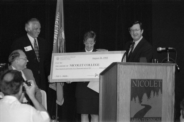 Congressman David R. Obey presents a big check to representatives of Nicolet College. As chairman or ranking member of the House Appropriations Committee Obey was skilled at securing federal funds for district projects.