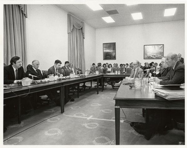 Secretary of State George Schultz during the Reagan Administration (first on the right) testifying before the Foreign Operations Subcommittee. Questioning him is Wisconsin Congressman David Obey, chair of the subcommittee.