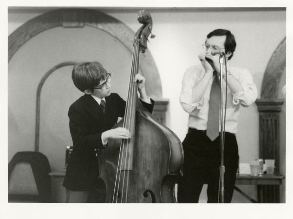 Congressman David Obey and his son Douglas perform at the "Salute to Congressman David Obey" by the Communication Workers of America. Douglas played the upright bass and David played his harmonica.