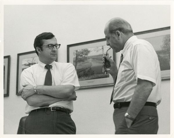 Congressman David Obey and Senator Gaylord Nelson in a thoughtful moment. On the wall in the background are landscape photographs.