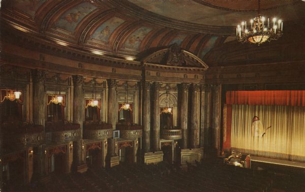 Colorized postcard view of the interior of the theatre as seen from a rear box in the main auditorium.