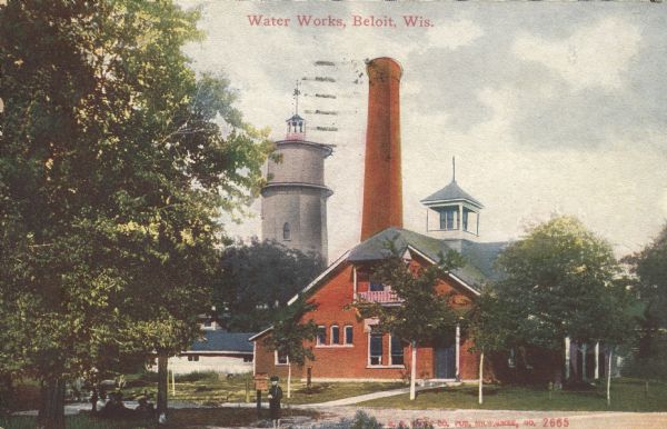 Colorized postcard view of the water works, smokestack and water tower. People are lounging under the trees in front. Caption reads: "Water Works, Beloit, Wis."