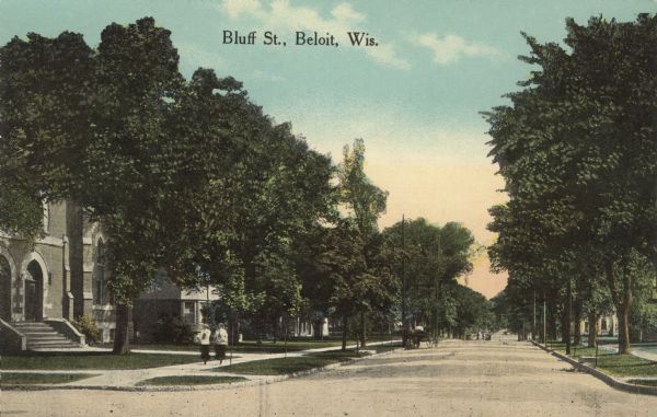 Colorized postcard view of a tree-lined street in a residential neighborhood. A church is on the left corner. A horse and cart are parked next to the curb further down the street. Two women are walking on the sidewalk. Caption reads: "Bluff St., Beloit, Wis."