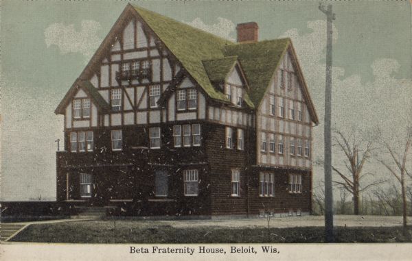 Colorized postcard view of the Tudor-style house on the Beloit College Campus. Caption reads: "Beta Fraternity House, Beloit, Wis."