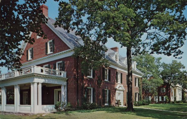 Photographic postcard view of Fraternity Row at Beloit College.