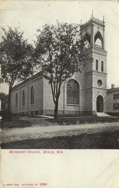 Photographic postcard view of the exterior of the Methodist Church. Caption reads: "Methodist Church, Berlin, Wis."