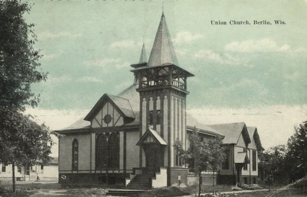 Postcard of an exterior view of a wooden church with two steeples. Caption reads: "Union Church, Berlin, Wis."