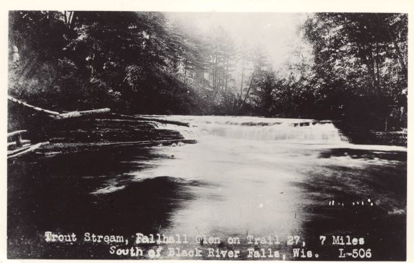Photographic postcard view of a trout stream with rapids and trees on the shoreline. Caption reads: "Trout Steam, Fallhall Glen on Trail 27, 7 Miles South of Black River Falls, Wis."