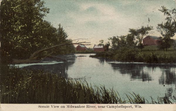 Colorized postcard view of a river scene and neighboring farm. Caption reads: "Scenic View on Milwaukee River, near Campbellsport, Wis."