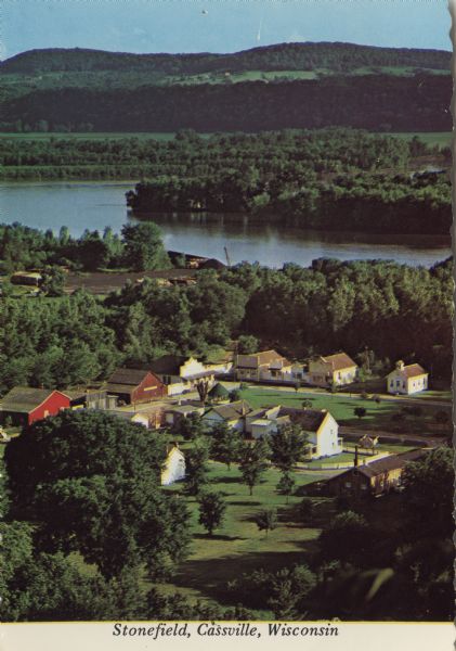 Elevated view of Stonefield Village, with the Mississippi River in the background. Caption reads: "Stonefield, Cassville, Wis."