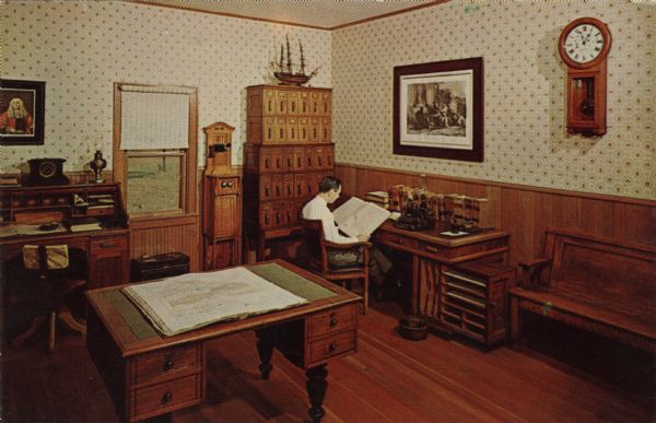 Color postcard of the interior of the Law Office at Stonefield. A man is seated at the desk.