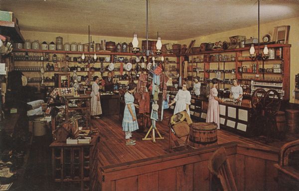 Color postcard of the Farmers' Store at Stonefield. Sales clerks, customers and merchandise set the scene.