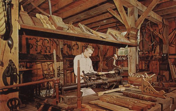 Color postcard of the carpenter's shop at Stonefield. Carpenters are operating lathes.